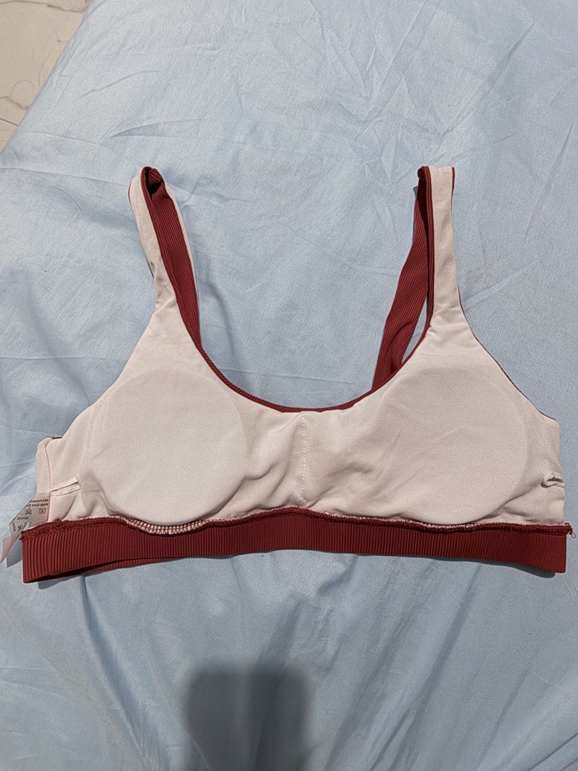 Ribbed Padded Sports Bra (Category: Activewear) located in Porac. Submitted by cheng.rz (Listing ID 1461050955, Image 3). Description: - Deep red ribbed sports bra - Removable padding included - Comfortable for workouts and everyday wear - Supportive strap width - Elastic band at the bottom for added support.