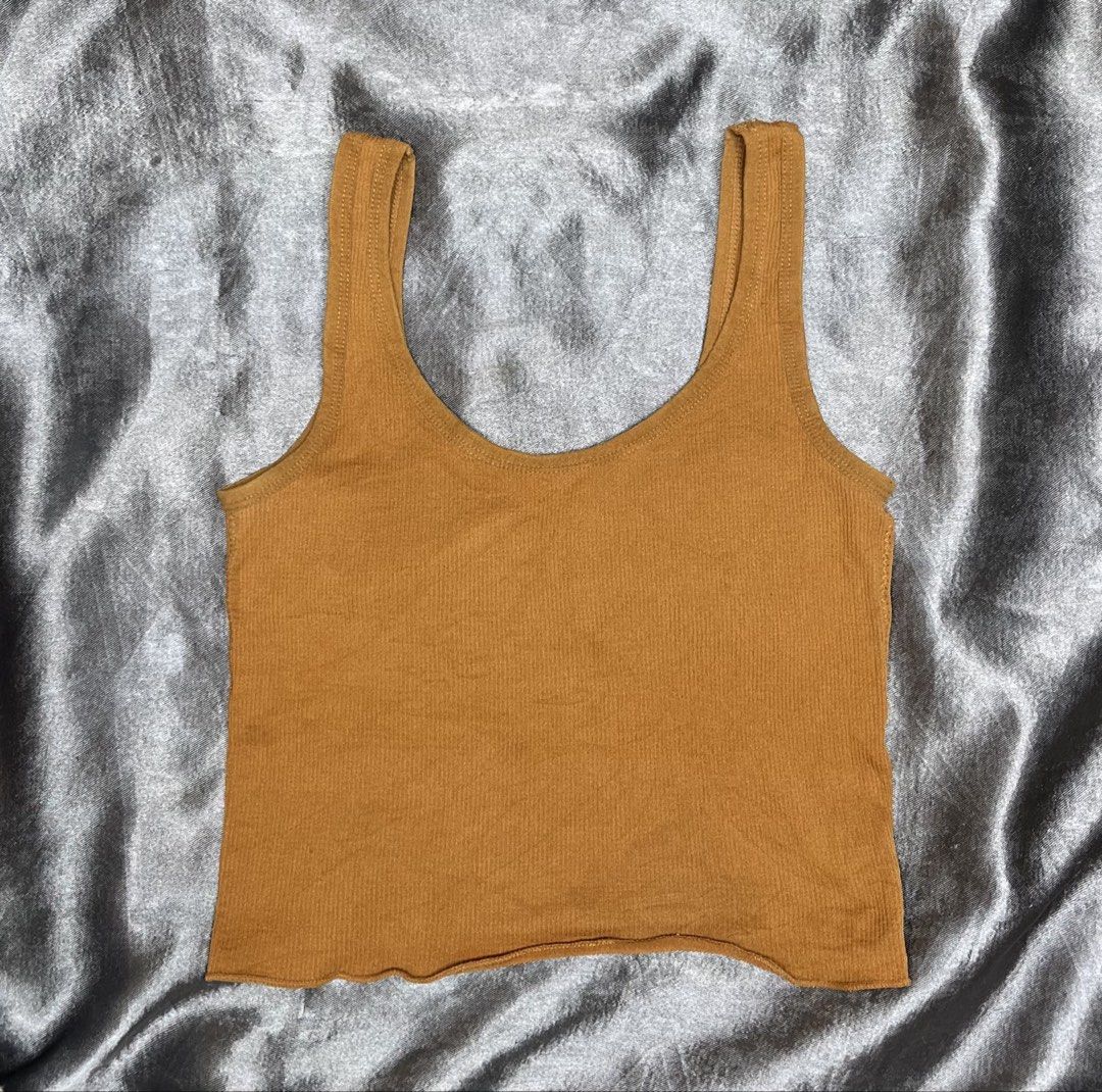 Ribbed Tank Top - Mustard Yellow (Category: Sleeveless) located in Cavite. Submitted by bellewii (Listing ID 1461047259, Image 1). Description: - Basic ribbed tank top - Mustard yellow color - Scoop neck and tank straps - Slightly wavy hem edge - Comfortable and stretchy material - Ideal for layering or wearing on its own.