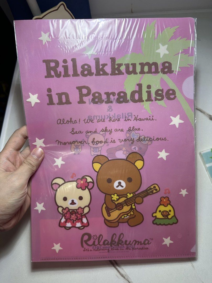 Rilakkuma in Paradise File Folder (Category: Stationery & School Supplies) located in Quezon City. Submitted by swift.thriftz (Listing ID 1461081887, Image 1). Description: - Cute Rilakkuma file folder - 'Rilakkuma in Paradise' theme - Features Rilakkuma, Korilakkuma, and Kiiroitori - Hawaiian setting with palm trees and stars - Perfect for organizing papers - Also a great collectible item - Fun and colorful design - Ideal for Rilakkuma fans.
