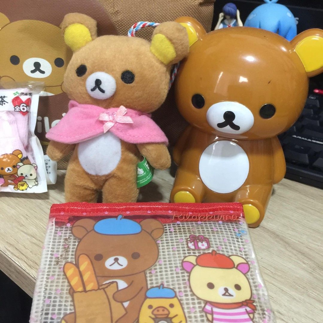 Rillakuma Set Display (Category: Character Goods) located in Manila. Submitted by ikawbasiwagwag8 (Listing ID 1461112187, Image 2). Description: - coin bank - plushie keychain - tumbler cover - mini bag - coin wallet all in good conditions.