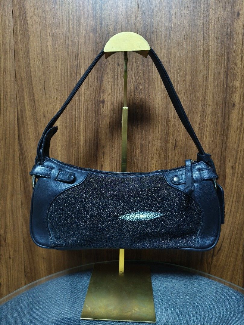 ROBERT DUE STINGRAY BAGUETTE BAG (Category: Shoulder Bags) located in Baguio. Submitted by PreiLoveMaria (Listing ID 1461050799, Image 2). Description: ROBERT DUE STINGRAY BAGUETTE BAG elegant black shoulder bag by Roberto Due Classic, featuring smooth leather trim combined with textured shagreen (stingray) leather panels and its distinctive central pearl-like eye/cluster detail on the front. It has a structured silhouette, a comfortable single s