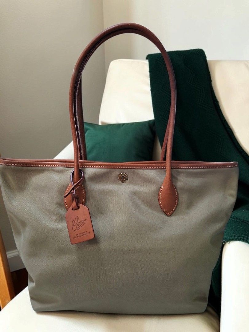 ROBERTA PIERI NYLON TOTE BAG (Category: Tote Bags) located in Las Pinas. Submitted by annachiaonair2037 (Listing ID 1460941396, Image 2). Description: ROBERTA PIERI NYLON TOTE FROM JAPAN MADE IN ITALY MAGNETIC SNAP CLOSURE UNUSED HANDLE DROP 9" NYLON WITH LEATHER HANDLES H 11" L 16.5" W 5.5" Disclaimer: I am not affiliated with, associated with, or authorized by any of the brands featured posted. Any mention of brand names, trademarks, or logos i