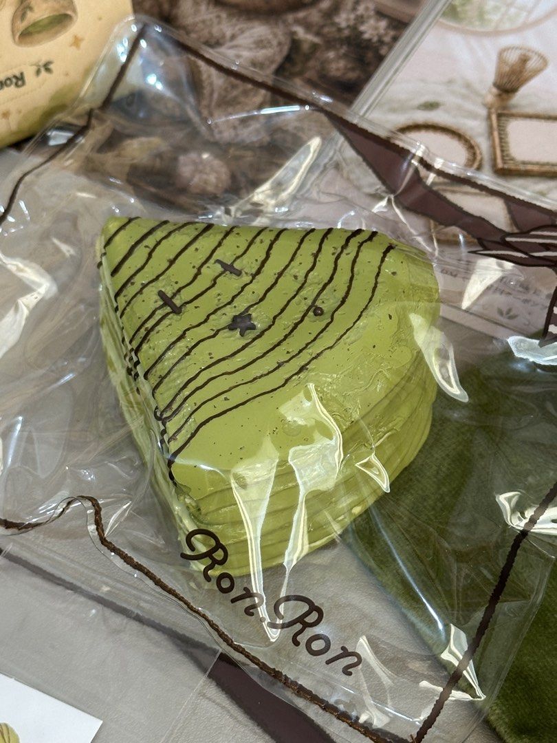 Ronron Matcha Nap | Matcha Mille-Crepe Cake (Category: Homemade Bakes) located in Tagbilaran City. Submitted by _harriet_ (Listing ID 1461063902, Image 3). Description: Texture: Creamy Clay-like | Soft/Smooth Creamy Studio: Ronron Matcha Nap | Matcha Mille-Crepe Cake Comes with: ♡ Collection card ♡ One replacement bag ♡ Collectible drawstring pouch ♡ Limited edition sticker with matching design ♡ Location: Bohol ♡ MOD: J&T (Shipping fee is ₱85) ♡