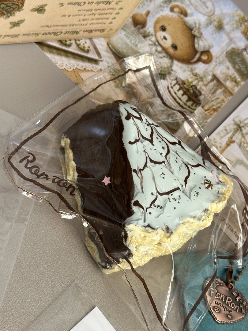 Ronron Mint Choco | Mint Chocolate Latte Art Slice (Category: Homemade Bakes) located in Tagbilaran City. Submitted by _harriet_ (Listing ID 1461066598, Image 2). Description: Ronron Mint Choco | Mint Chocolate Latte Art Slice Texture: Milky Muddy Comes with: ♡ Collection card ♡ One replacement bag ♡ Collectible drawstring pouch ♡ Limited edition sticker with matching design ♡ Location: Bohol ♡ MOD: J&T (Shipping fee is ₱85) ♡ MOP: Gcash | Maya |