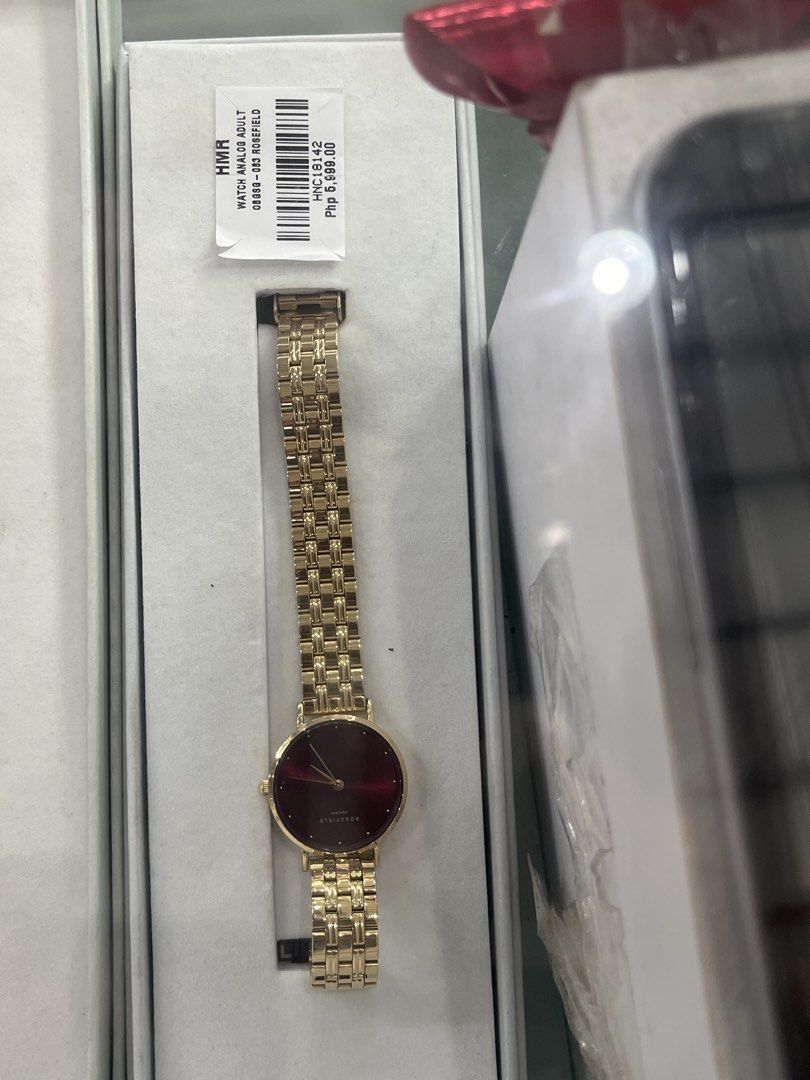 Rosefield Analog Watch Gold Red Dial (Category: Women's Watches) located in Caloocan City. Submitted by hmr.gomez (Listing ID 1460959762, Image 1). Description: - Rosefield analog watch - Luxurious gold band - Deep red dial - Classic, versatile design - Suitable for adults - Ideal for any occasion - Comes in original packaging.
