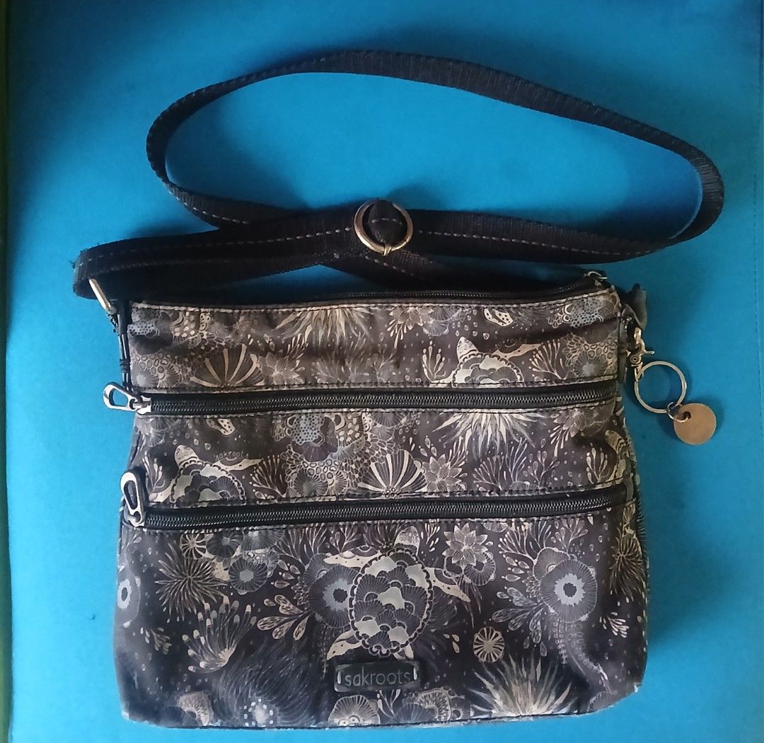 Sakroots Crossbody Bag (Category: Cross-body Bags) located in Quezon City. Submitted by goldenearth_14ecb6 (Listing ID 1460982739, Image 1). Description: - Stylish Sakroots crossbody bag with a vibrant print. - Multiple pockets inside for excellent organization. - Features a convenient zip pocket on the back.and front - Adjustable strap for a comfortable fit. - in good condition - perfect for everyday use.