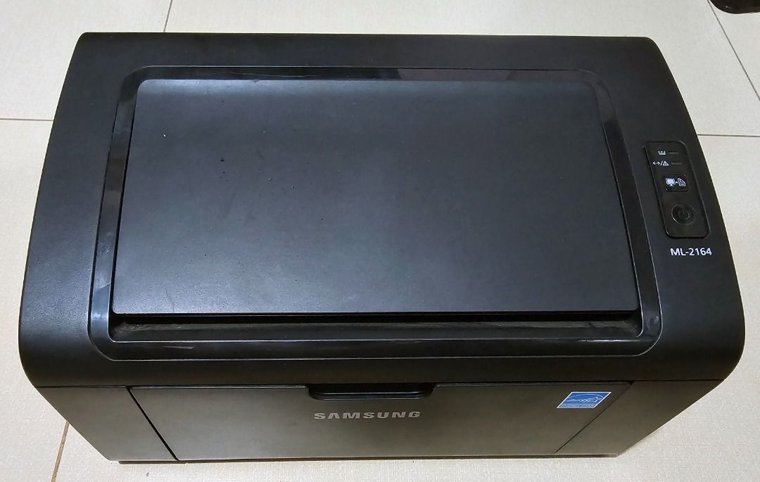 Samsung ML-2164 Laser Printer Monochrome (Category: Printers, Scanners & Copiers) located in Paranaque City. Submitted by leejay.vidal (Listing ID 1460921811, Image 3). Description: Please read carefully. Hindi na ako magrereply kung nandito na ang sagot sa details ng ad. Samsung ML-2164 Laser Printer Monochrome Black and White only NO WIFI Hindi ito refurbished or reconditioned printer. Personal use ito sa small business. No history of repair, a