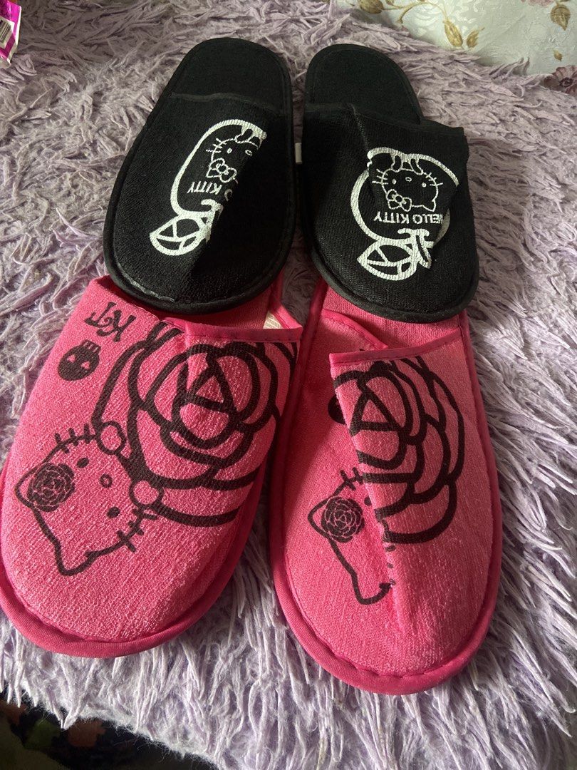 Sanrio Hello Kitty Slippers - Black & Pink (Category: Slippers and slides) located in Davao. Submitted by mengsmixitems (Listing ID 1461053082, Image 1). Description: - Soft and cozy indoor slippers - Available in two adorable designs: Black with white Kitty logo OR Pink with large rose and Kitty - Perfect gift for any Sanrio or Kitty enthusias -fit to size 6 /7.