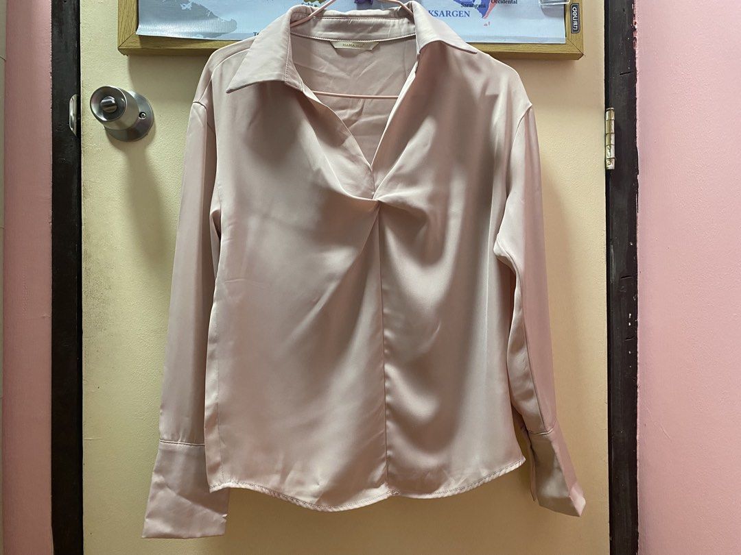 Satin Twist Front Collared Long Sleeve Blouse (Category: Blouses) located in Quezon City. Submitted by jeseym.23 (Listing ID 1461050657, Image 2). Description: - Light pink satin blouse - Twist detail at neckline - Collared design - Long sleeves with button cuffs - Loose type when worn - Versatile for dressing up or down - Comfortable and stylish.