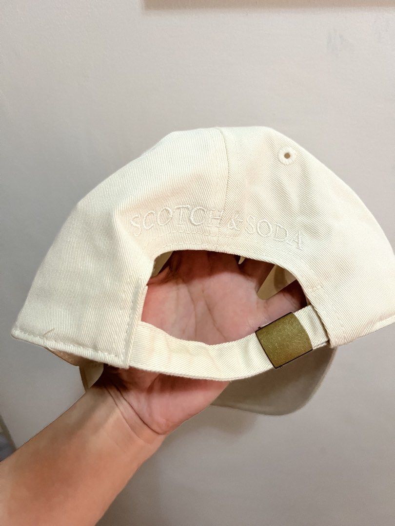 Scotch & Soda LA Cap (Category: Caps & Hats) located in Manila. Submitted by ertzn (Listing ID 1460941216, Image 2). Description: - Cream colored cap - 'LA' embroidered on the front - Scotch & Soda logo embroidered on the back - Adjustable strap for a custom fit - One size fits most.