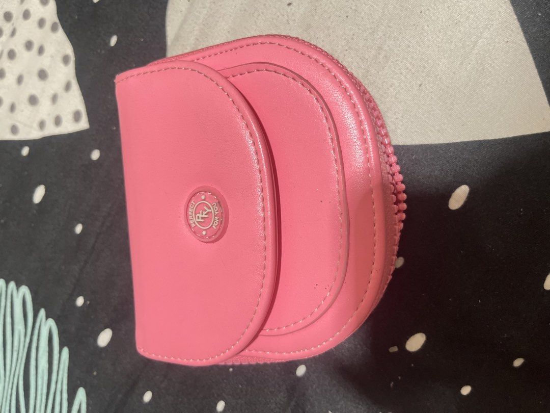 Secosana Cosmetic Bag & Wallet (Category: Purses & Pouches) located in Naga. Submitted by Carmel_C (Listing ID 1461076689, Image 2). Description: - Secosana Black Cosmetic Bag: Zippered closure, clean interior. - Secosana Pink Coin Pouch: Snap closure, zippered compartment. - Both ideal for organizing your essentials. - Pink pouch shows minor signs of wear; both in good overall condition. - Perfect for travel or everyday use..