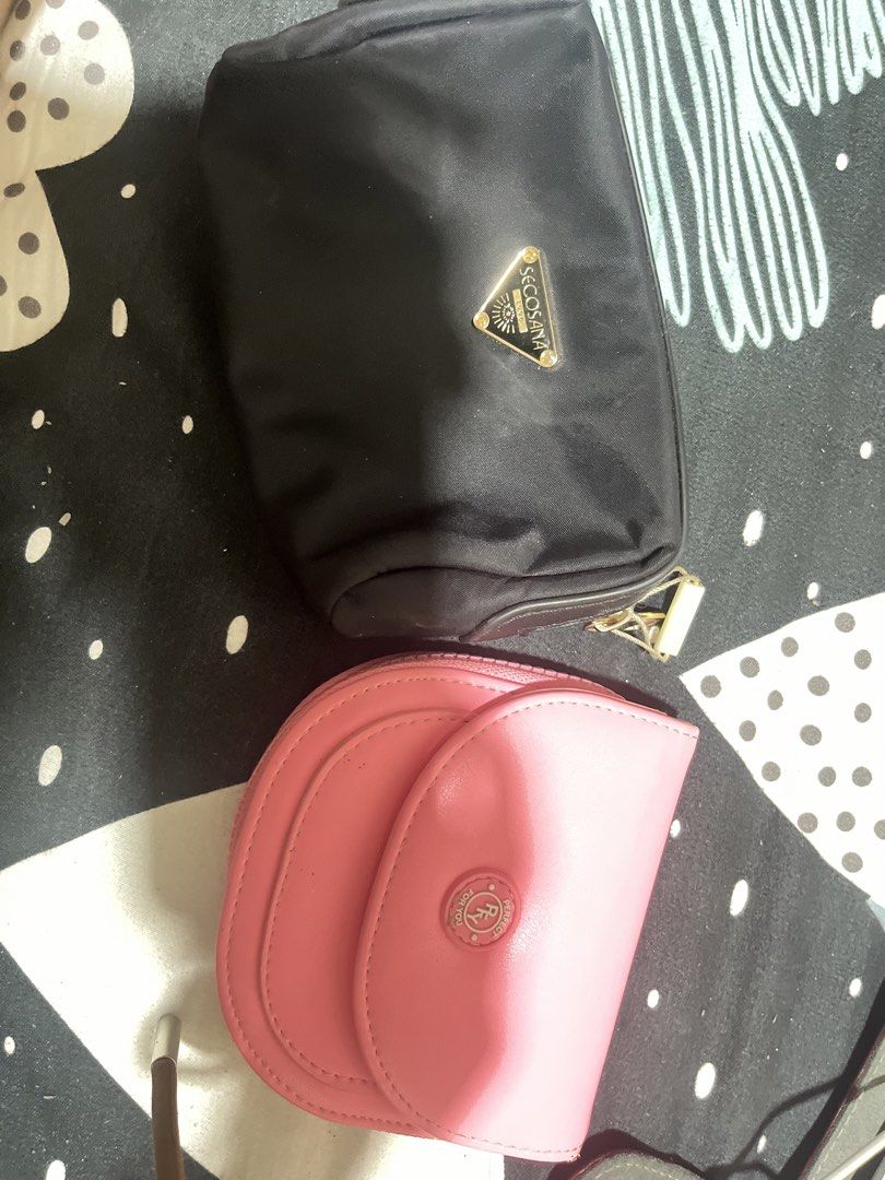 Secosana Cosmetic Bag & Wallet (Category: Purses & Pouches) located in Naga. Submitted by Carmel_C (Listing ID 1461076689, Image 1). Description: - Secosana Black Cosmetic Bag: Zippered closure, clean interior. - Secosana Pink Coin Pouch: Snap closure, zippered compartment. - Both ideal for organizing your essentials. - Pink pouch shows minor signs of wear; both in good overall condition. - Perfect for travel or everyday use..