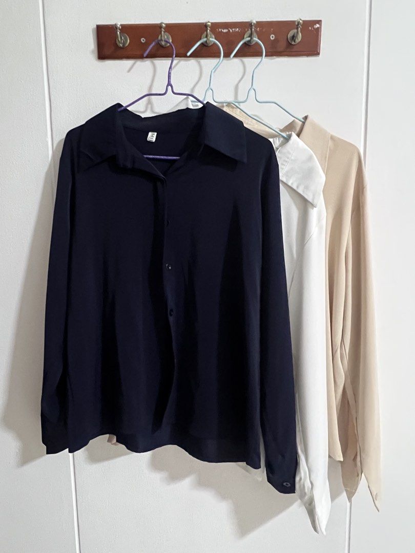(Set) 3 basic button up blouses (Category: Blouses) located in Singapore. Submitted by wildsk1ttleszss (Listing ID 1461065685, Image 1). Description: Dm for measurements Navy, white and beige Perfect for work.