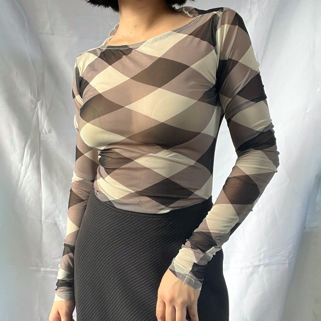 Sheer Mesh Long Sleeve Top - Diamond Print (Category: Longsleeves) located in Manila. Submitted by demi.rewears (Listing ID 1460927497, Image 1). Description: Sheer mesh long sleeve top with a diamond pattern in brown, beige, and off-white. Features a boat neckline and form-fitting silhouette. Perfect for layering or a stylish night out. Size: Fits XS to Small Bust: Fits 24” to 28” (12.5” flat lay) Length: 22” (Regular length).