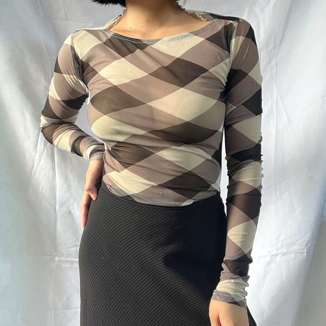Sheer Mesh Long Sleeve Top - Diamond Print (Category: Longsleeves) located in Manila. Submitted by demi.rewears (Listing ID 1460927497, Image 3). Description: Sheer mesh long sleeve top with a diamond pattern in brown, beige, and off-white. Features a boat neckline and form-fitting silhouette. Perfect for layering or a stylish night out. Size: Fits XS to Small Bust: Fits 24” to 28” (12.5” flat lay) Length: 22” (Regular length).
