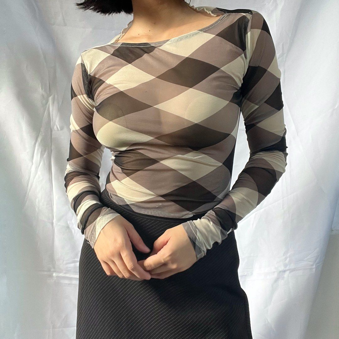 Sheer Mesh Long Sleeve Top - Diamond Print (Category: Longsleeves) located in Manila. Submitted by demi.rewears (Listing ID 1460927497, Image 2). Description: Sheer mesh long sleeve top with a diamond pattern in brown, beige, and off-white. Features a boat neckline and form-fitting silhouette. Perfect for layering or a stylish night out. Size: Fits XS to Small Bust: Fits 24” to 28” (12.5” flat lay) Length: 22” (Regular length).