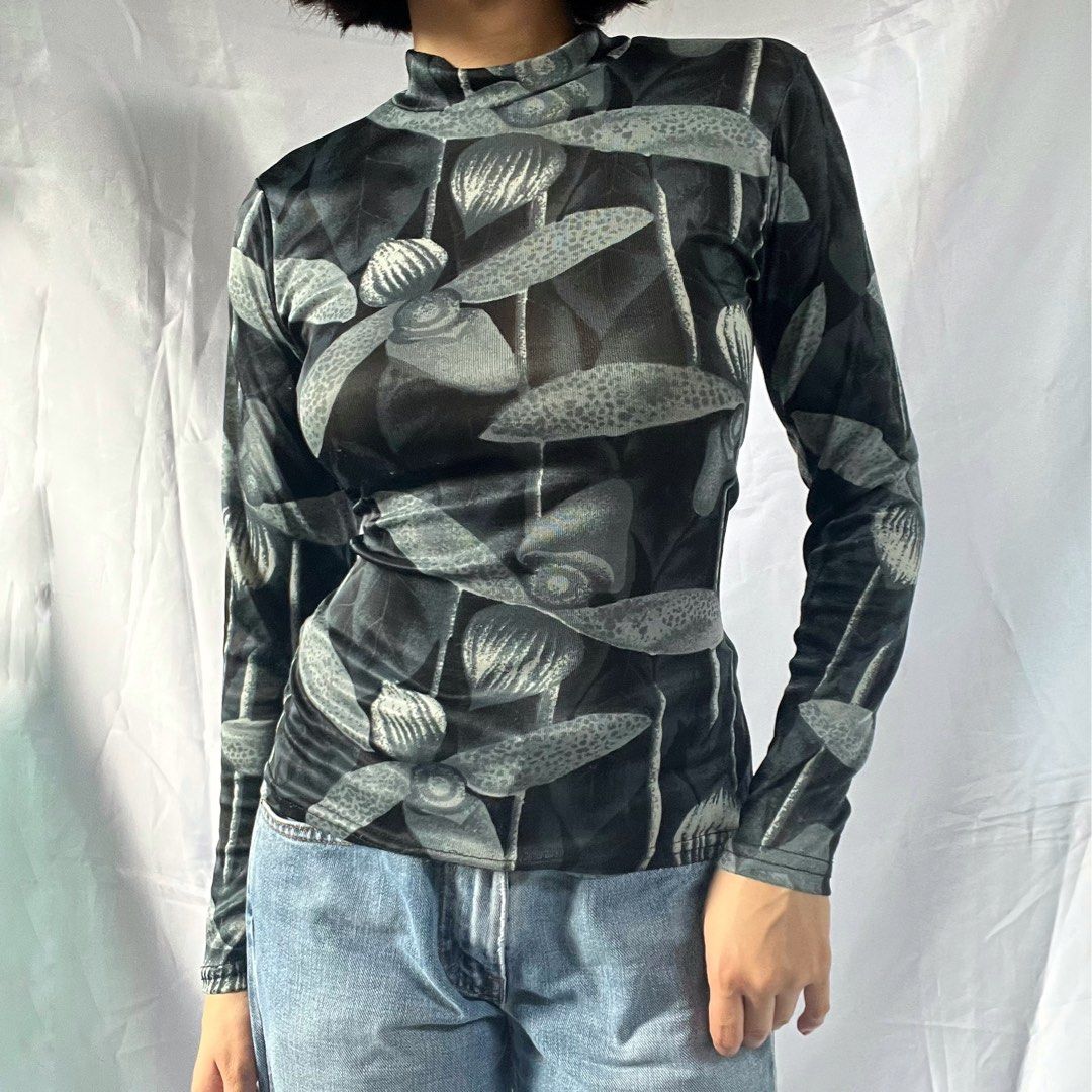 Sheer Mesh Mock Neck Long Sleeve Top (Category: Longsleeves) located in Manila. Submitted by demi.rewears (Listing ID 1460926595, Image 1). Description: Edgy black and grey abstract floral mesh top. Mock neck, long sleeves, very stretchy. Layer it up! Size: Fits Small to Semi-Medium Bust: Fits 29” to 32” (14.5” flat lay) Length: 20.5” (Regular length).