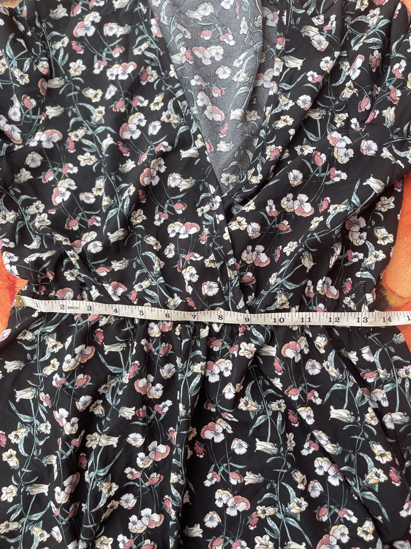 SHEIN Black Floral Bell Sleeve Romper (Category: Rompers) located in Manila. Submitted by aikyy_ (Listing ID 1460922447, Image 2). Description: - Cute black romper with a lovely floral print. - Features stylish bell sleeves and a flattering V-neck. - Elasticated waist ensures a comfortable and adjustable fit. - Perfect for casual outings or evenings with friends. - Brand: SHEIN - Measurements are available in the product photos..