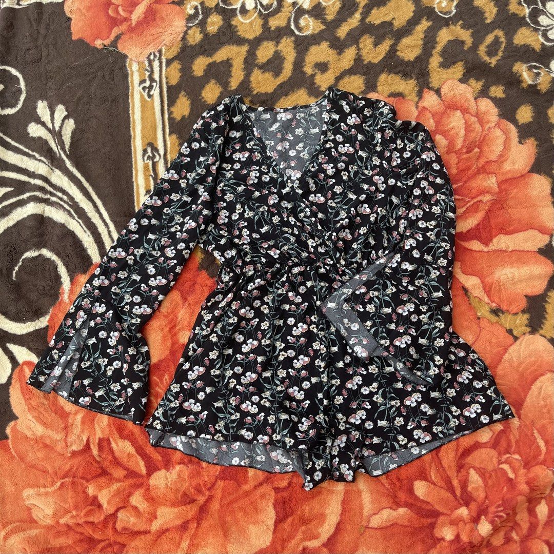 SHEIN Black Floral Bell Sleeve Romper (Category: Rompers) located in Manila. Submitted by aikyy_ (Listing ID 1460922447, Image 1). Description: - Cute black romper with a lovely floral print. - Features stylish bell sleeves and a flattering V-neck. - Elasticated waist ensures a comfortable and adjustable fit. - Perfect for casual outings or evenings with friends. - Brand: SHEIN - Measurements are available in the product photos..