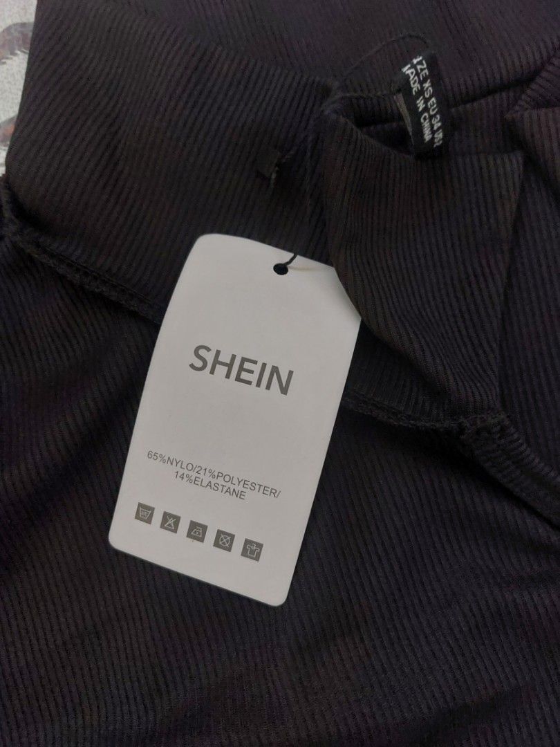SHEIN Black Ribbed Terno (Category: Blouses) located in Malaybalay. Submitted by mags_sofia (Listing ID 1461013707, Image 3). Description: - Dark brown ribbed mock neck top with ribbed ahorts - Brand: SHEIN - Size: XS, can stretch up to M - Material: Nylon, Polyester, Elastane blend - Features: Short sleeves - Condition: Brand new with tags, never worn - Style: Versatile basic piece.