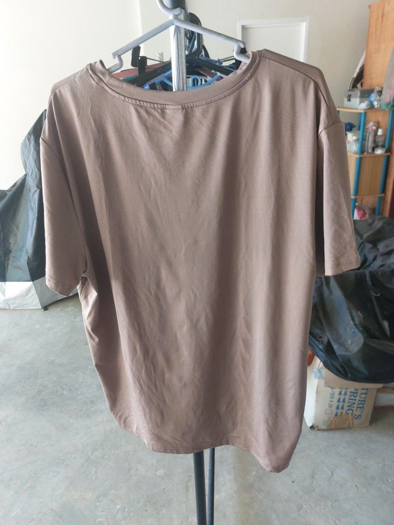 SHEIN Brown T-shirt (Category: Tshirts & Polo Shirts ) located in Malaybalay. Submitted by mags_sofia (Listing ID 1461014093, Image 2). Description: - Color: Brownish-taupe - Graphic: White 'freedom' print (vertical) - Neckline: Crew neck - Sleeves: Short sleeves - Fabric: Soft, slightly textured - Size: L - Style: Casual wear.