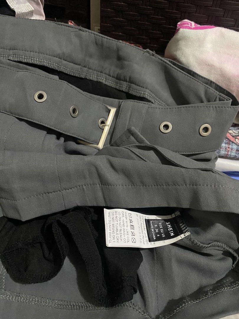 SHEIN Grey Cargo Belted Mini Skirt (Category: Skirts) located in Manila. Submitted by stormibutterfly26 (Listing ID 1461083375, Image 2). Description: SHEIN Skort grey cargo mini skirt, Size S-M Features a matching belt, buckle, and multiple front pockets. Perfect for casual or edgy outfits..