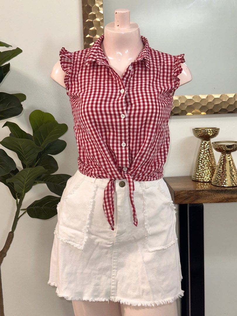 SHEIN Red Gingham Tie-Front Button-Up Shirt Top (Category: Blouses) located in Balanga. Submitted by amberinesis (Listing ID 1460942360, Image 1). Description: - Cute red and white gingham pattern - Tie-front design - Sleeveless with ruffled cap sleeves - Button-up front - Brand: SHEIN - Perfect for a casual summer outfit.