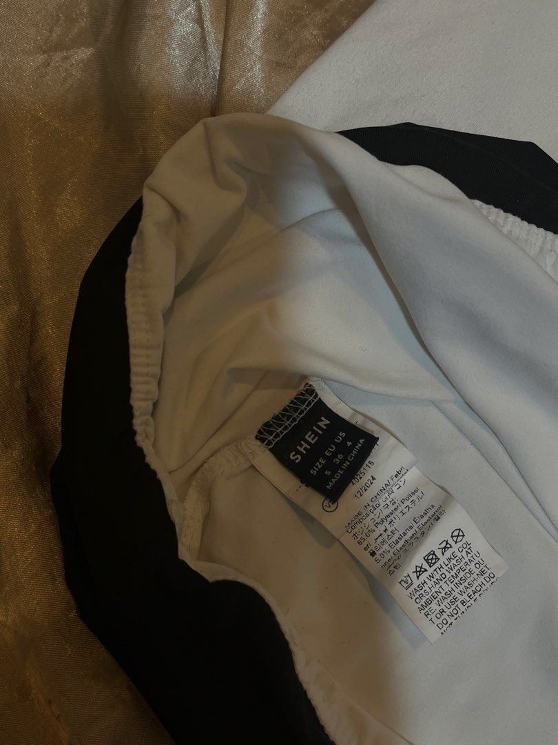 SHEIN White & Black Tube Top (Category: Sleeveless) located in Manila. Submitted by rhian_leighhh (Listing ID 1461113462, Image 2). Description: - White tube top - Black band detail at the top - Stretchy material for a comfortable fit - Size S (fits US 4/6) - Originally purchased from SHEIN - Versatile: great for layering or wearing on its own.