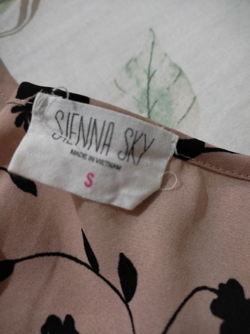 Sienna Sky Pink Floral Top Size S (Category: Others Tops) located in Tarlac. Submitted by momma02 (Listing ID 1460979282, Image 2). Description: - Pink top with elegant black floral print - Short sleeves with a stylish flutter effect - Functional button detail down the front - Flattering shirring detail on the sides - Made from comfortable 100% polyester - Brand: Sienna Sky - Size: S new, unused, tags removed.
