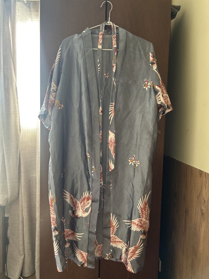 Silk Robe (Category: Coats, Jackets and Outerwear) located in Makati City. Submitted by secondseries (Listing ID 1460954777, Image 1). Description: - Beautiful grey kimono robe - Features a stunning crane and floral print - Short sleeves and open front design - Fabric has a lovely sheen - Ideal for lounging or stylish layering - Approximately 35 inches long from shoulder to hem - One size fits most.