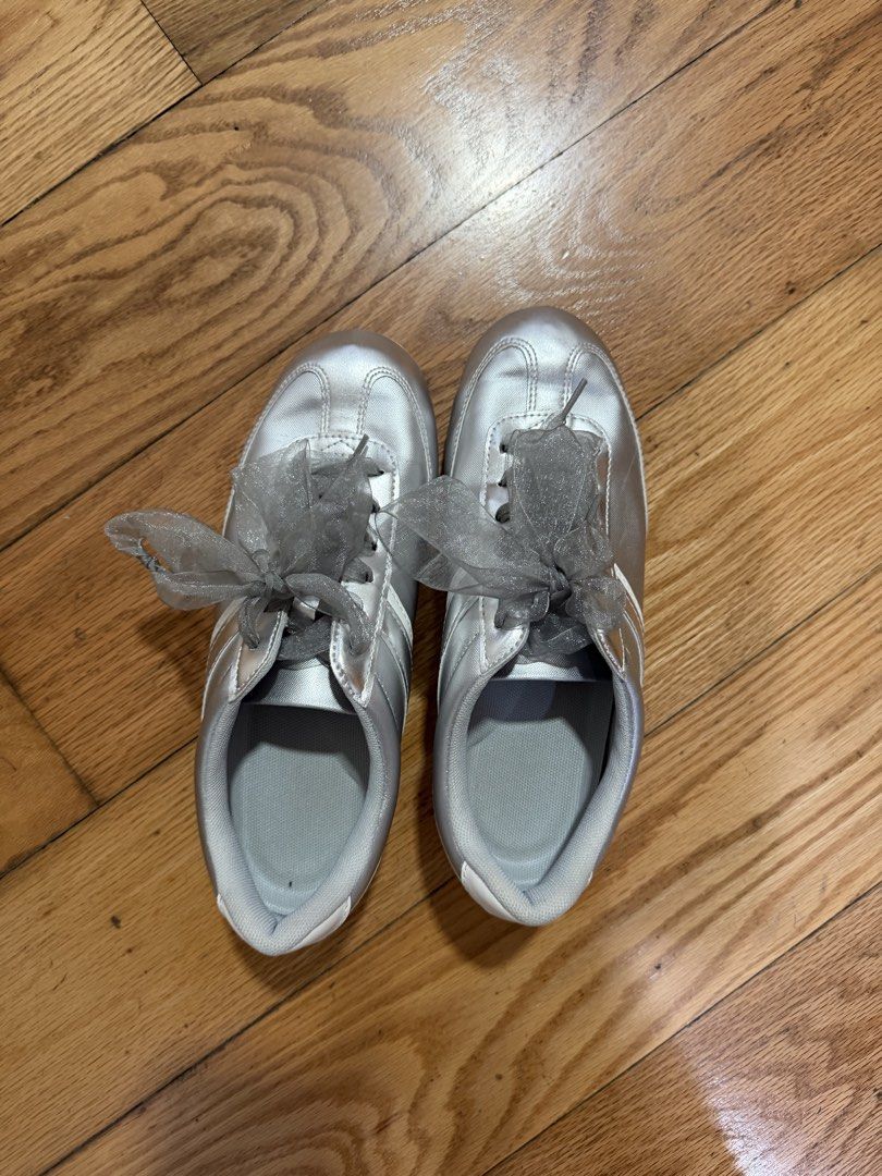 Silver Sneakers with Ribbon Laces (Category: Sneakers) located in Caloocan City. Submitted by preloveditemsbyyana (Listing ID 1461035008, Image 1). Description: - Stylish silver sneakers - Features grey ribbon laces - Durable black soles with chevron pattern - Marked as size M - Made in China - Perfect for casual wear.