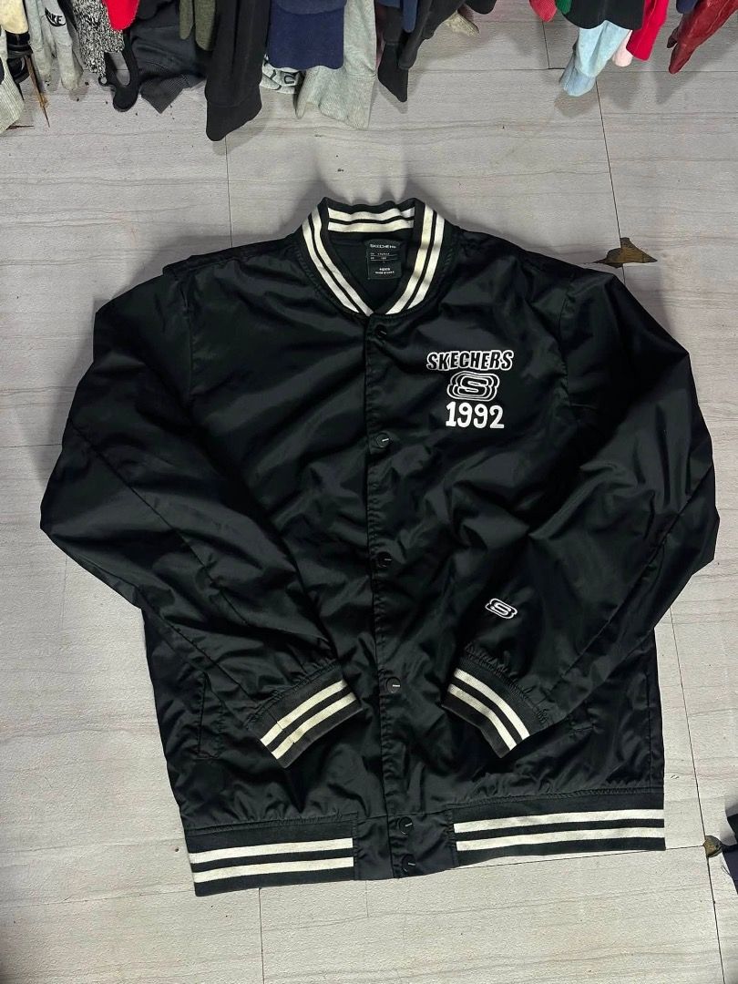 Sketchers black varsity jacket (Category: Coats, Jackets and Outerwear) located in Manila. Submitted by nb_thriftshop (Listing ID 1461062886, Image 1). Description: sk3chers varsity jacket 27 length 22 width medium to large no issue need wash .
