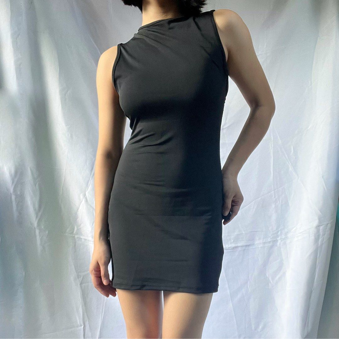 Sleeveless Mock Neck Mini Dress Black (Category: Dresses) located in Manila. Submitted by demi.rewears (Listing ID 1461069306, Image 3). Description: Black sleeveless mini dress with mock neck. Stretchy fabric. Above-the-knee length. Easy to style. Size: Fits Extra Small to Small (Tag: XS / Very Stretchable / Asian Fit) Bust: Fits 29” to 33” (15” flat lay) Waist: Fits 21” to 26” (11” flat lay) Length: 30” (Above the knee).