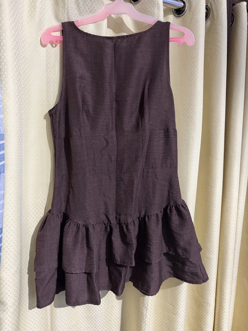 Sleeveless Ruffle Hem Dress (Category: Dresses) located in Quezon City. Submitted by m.angelaaa (Listing ID 1461101980, Image 1). Description: - Dark brown sleeveless dress - Tiered ruffle hemline for a stylish flair - Simple scoop neckline - Versatile for casual outings or dressing up - size medium.