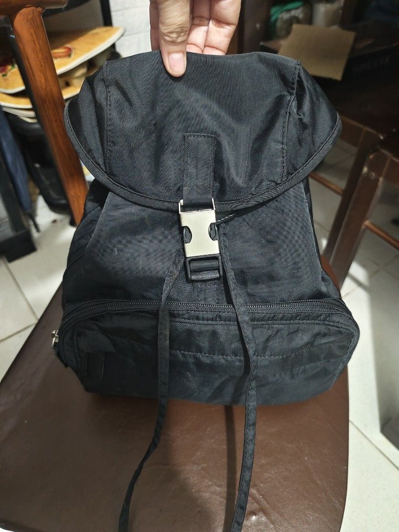 Small Nylon Backpack Black (Category: Backpacks) located in Cavite. Submitted by sweetalittlemonstertoo (Listing ID 1461094921, Image 1). Description: - Black nylon backpack - Front zip pocket - Main compartment - Adjustable straps - Buckle closure on flap - Shows some signs of wear on fabric and hardware - Ideal for daily use.