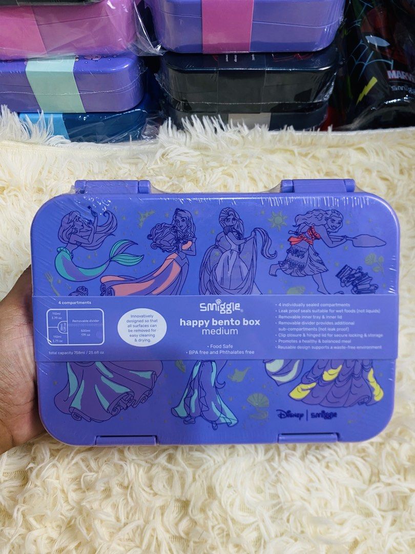 Smiggle Happy Bento Box Medium - Various Designs (Category: Food Organization & Storage) located in Manila. Submitted by mariamicaella24 (Listing ID 1461094571, Image 3). Description: - Smiggle Happy Bento Box (Medium Size) - Available in cute designs: Bunnies, Gaming Controllers, Princesses, Dinosaurs - Features 4 compartments - Includes a removable divider for customization - Ideal for packing healthy and fun lunches - Made from BPA and phthala