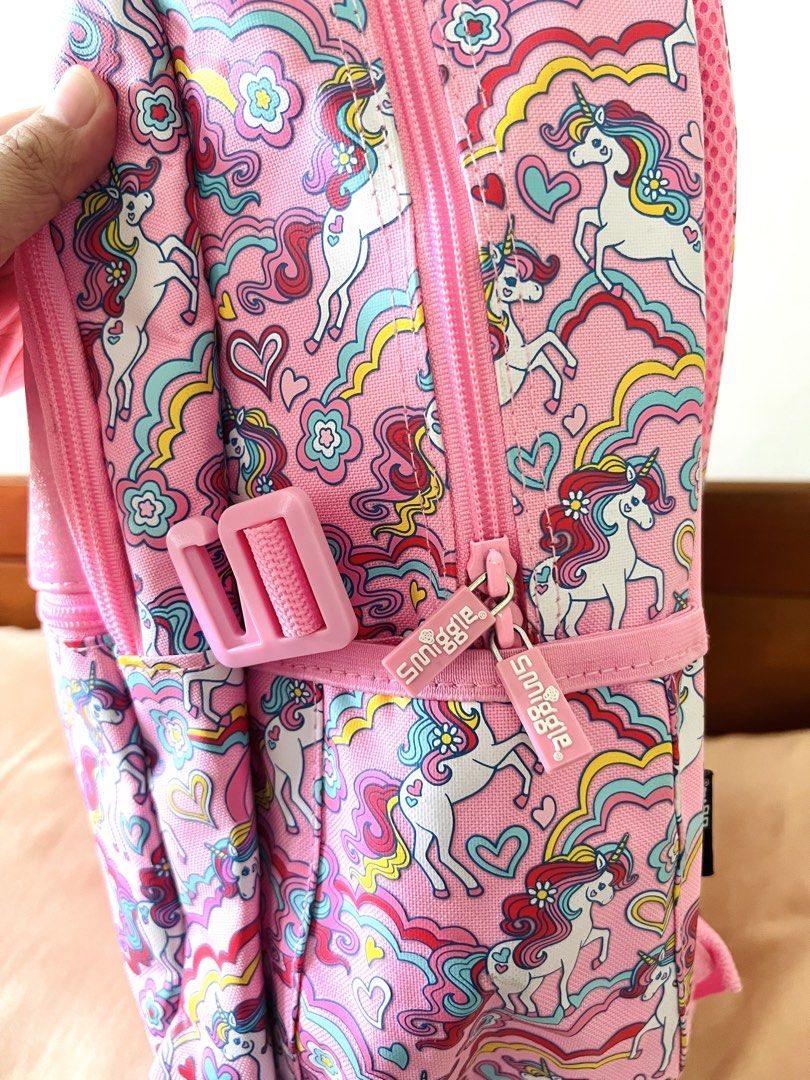 Smiggle Unicorn Backpack 🦄✨ (Category: Backpacks) located in Binan City. Submitted by prebylouise (Listing ID 1460973478, Image 3). Description: Super cute Smiggle unicorn backpack in pink! Perfect for school, playdates, travel, or everyday adventures. 🎀 ✨ Features: • Adorable unicorn design • Spacious main compartment • Front zippered pocket • Side mesh pocket for water bottle • Adjustable padded shoulder straps • Fun Smiggle zipper pulls • Cu