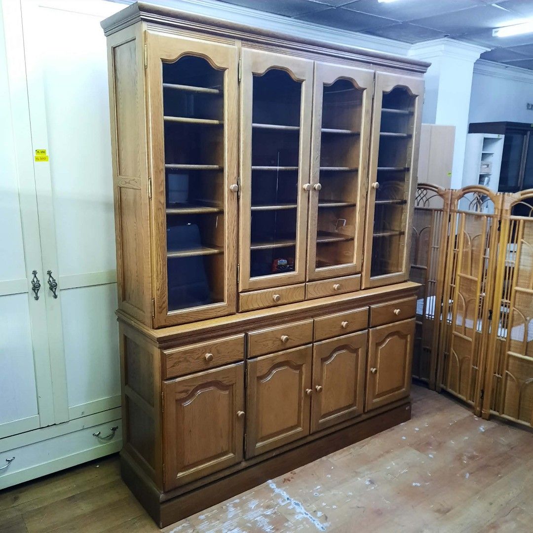 Solid Wood Display Cabinet with Glass Doors and Drawers (Category: Shelves, Cabinets & Racks) located in Manila. Submitted by ivan_furnitures421 (Listing ID 1460925857, Image 3). Description: - Large wooden display cabinet - Four glass doors on top with shelves - Four drawers and four cabinet doors below - Generous storage space - Ideal for books, collectibles, or dishes - Constructed from solid wood.