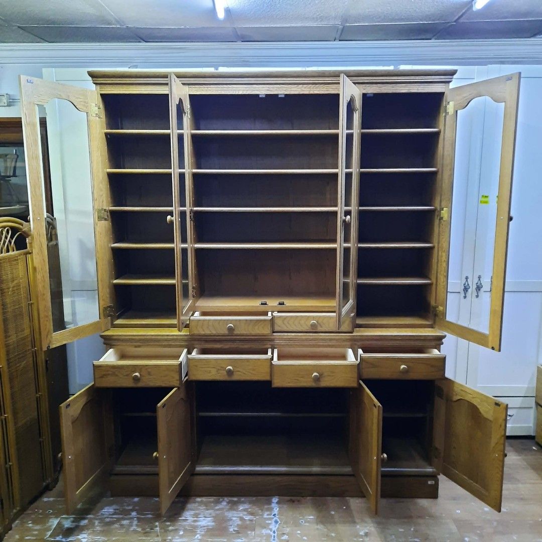 Solid Wood Display Cabinet with Glass Doors and Drawers (Category: Shelves, Cabinets & Racks) located in Manila. Submitted by ivan_furnitures421 (Listing ID 1460925857, Image 2). Description: - Large wooden display cabinet - Four glass doors on top with shelves - Four drawers and four cabinet doors below - Generous storage space - Ideal for books, collectibles, or dishes - Constructed from solid wood.