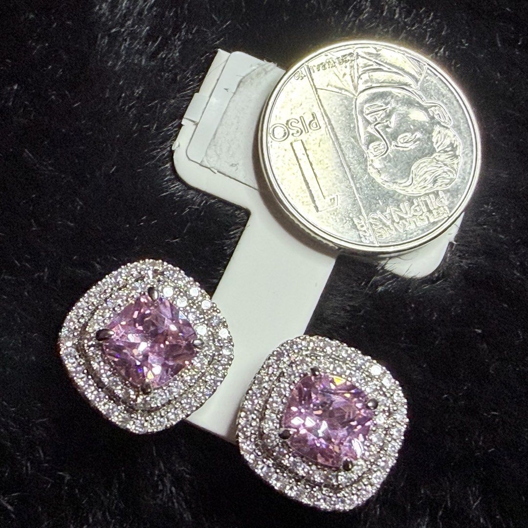 Sparkling Stud Earrings with Cubic Zirconia (Category: Earrings) located in Cavite. Submitted by jahnnan07 (Listing ID 1461004949, Image 3). Description: - Beautiful stud earrings with clear and pink stones. - Classic design with a halo of smaller stones. - Adds sparkle to any outfit. - Versatile for everyday wear or special occasions. - Coin included for size reference..