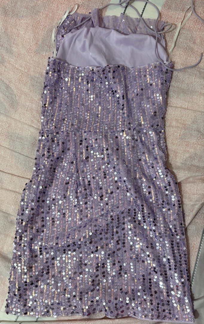 Sparkly Lavender Halter Sequin Mini Dress (Category: Dresses) located in Pasig City. Submitted by juliexxxx (Listing ID 1460991427, Image 2). Description: Can fit xxs-s. double lining mini dress. Perfect for occasions! used only once. Selling it for a low price na lang 🤍 Loc: Ortigas Pasig.