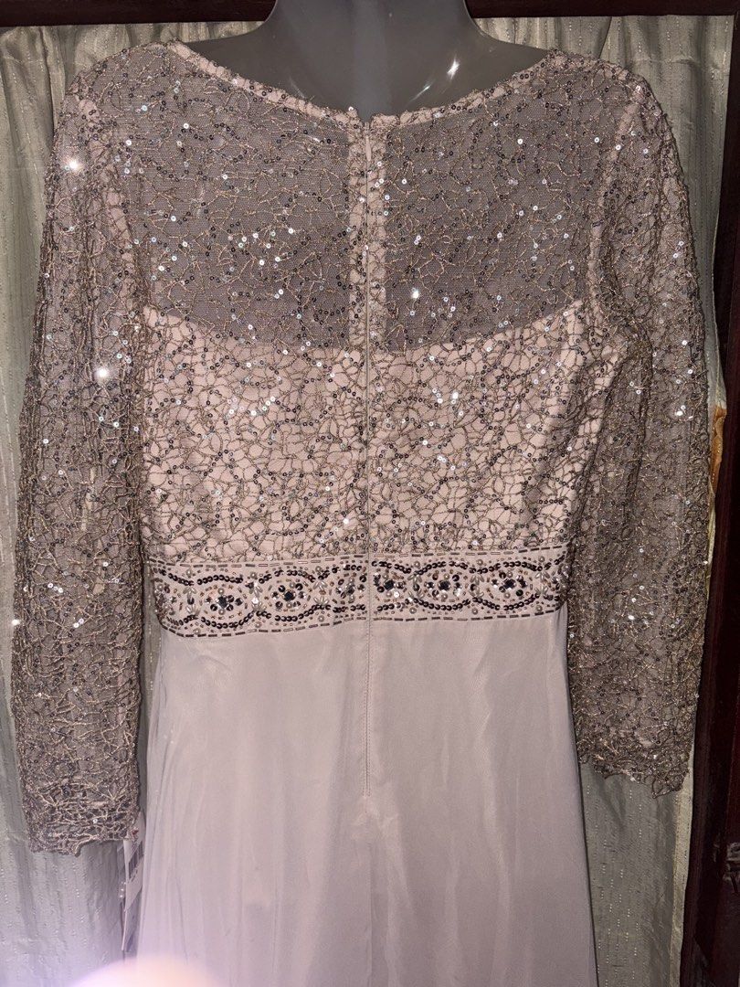 Sparkly Sequin Long Sleeve Maxi Dress (Category: Dresses) located in Manila. Submitted by thriftwithbarbi (Listing ID 1460978902, Image 3). Description: - Elegant long sleeve maxi dress - Intricate sequin and beading on the bodice - Sheer sleeves with matching sequin details - Flowy, lightweight skirt for graceful movement - Zipper closure at the back - Ideal for formal events, parties, and special occasions.