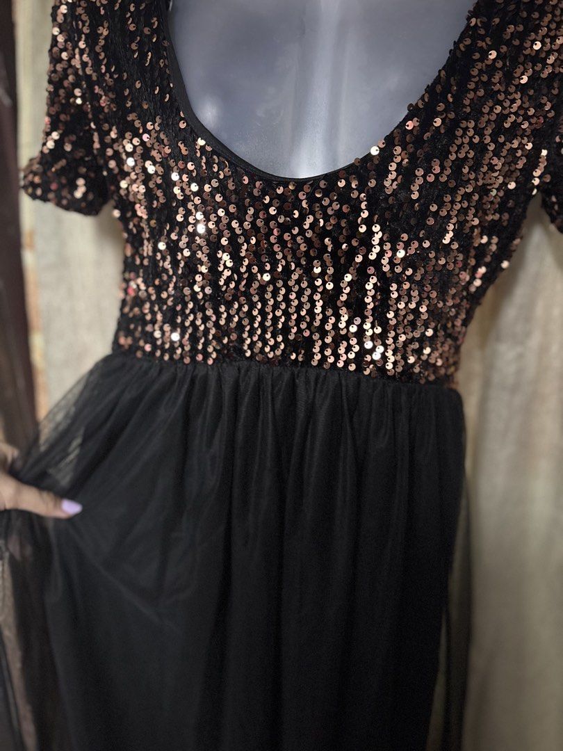Sparkly Sequin Top Black Tulle Maxi Dress (Category: Dresses) located in Manila. Submitted by thriftwithbarbi (Listing ID 1460977960, Image 2). Description: - Elegant black maxi dress - Features a dazzling rose gold sequin top - Short sleeves for a comfortable fit - Flowy black tulle skirt for a graceful look - Ideal for parties, weddings, and special occasions - Designed to shine and look amazing under any light.