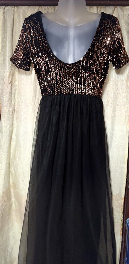 Sparkly Sequin Top Black Tulle Maxi Dress (Category: Dresses) located in Manila. Submitted by thriftwithbarbi (Listing ID 1460977960, Image 1). Description: - Elegant black maxi dress - Features a dazzling rose gold sequin top - Short sleeves for a comfortable fit - Flowy black tulle skirt for a graceful look - Ideal for parties, weddings, and special occasions - Designed to shine and look amazing under any light.