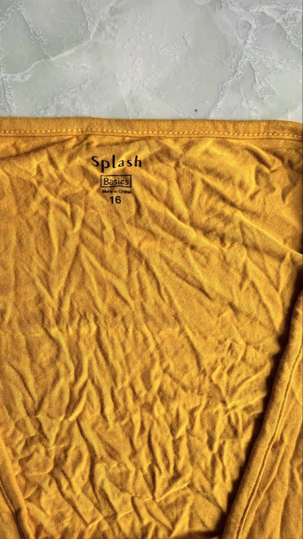Splash Basics Yellow Cropped Cardigan (Category: Coats, Jackets and Outerwear) located in General Santos City (Dadiangas). Submitted by ssssshhhhhhhhh (Listing ID 1460949650, Image 2). Description: - Yellow cropped cardigan - Brand: Splash Basics - Size: 16 - Long sleeves - Single button closure - Lightweight material - Ideal for layering over tops or dresses.