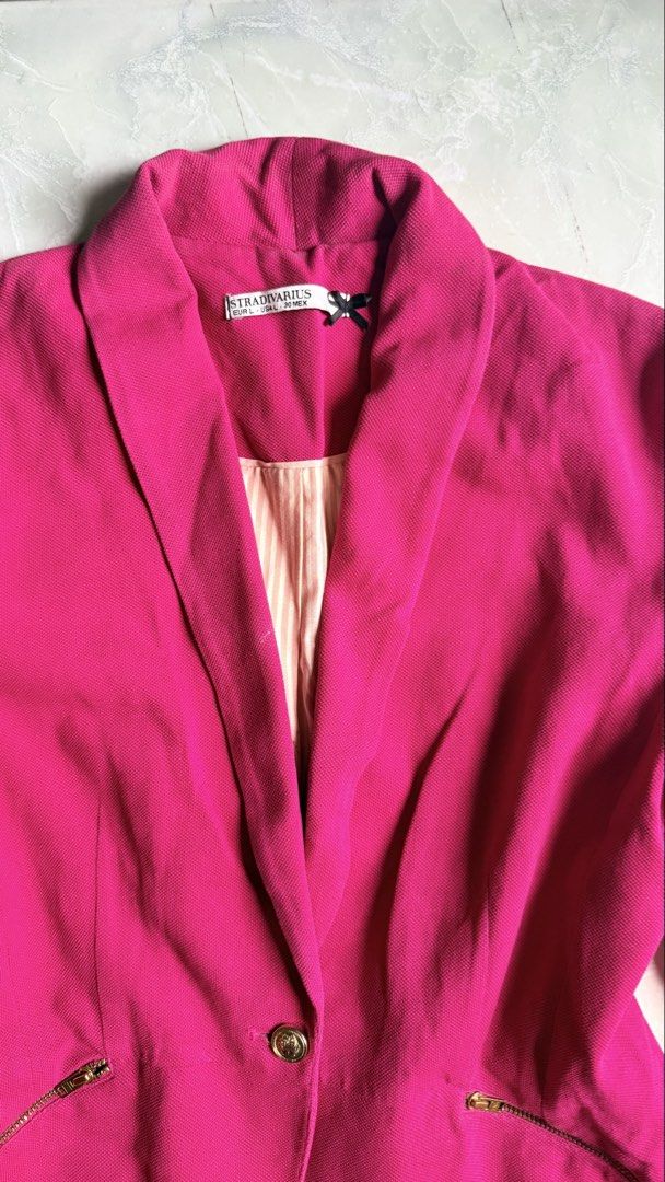 Stradivarius Pink Blazer (Category: Coats, Jackets and Outerwear) located in General Santos City (Dadiangas). Submitted by ssssshhhhhhhhh (Listing ID 1460949559, Image 2). Description: - Bright pink blazer from Stradivarius - Size L - Gold zipper details on pockets - Single button closure - Subtle stripe pattern on inner lining - Ideal for dressing up outfits.