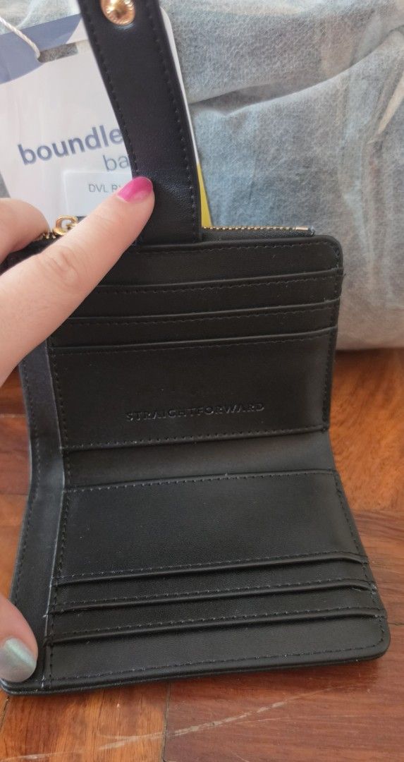Straightforward Black Card Holder Wallet with Zipper (Category: Wallets & Card holders) located in Caloocan City. Submitted by echoes_of_nnah (Listing ID 1461009290, Image 2). Description: - Brand: Straightforward - Color: Black - Features: Main zipper compartment, multiple card slots (inside & out) - Details: Embossed logo on front, gold hardware - Size: Compact and easy to carry.