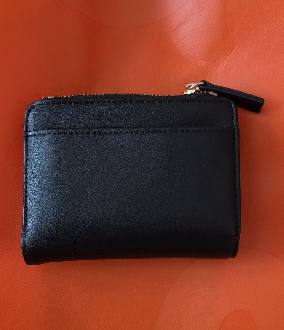 Straightforward Black Card Holder Wallet with Zipper (Category: Wallets & Card holders) located in Caloocan City. Submitted by echoes_of_nnah (Listing ID 1461009290, Image 3). Description: - Brand: Straightforward - Color: Black - Features: Main zipper compartment, multiple card slots (inside & out) - Details: Embossed logo on front, gold hardware - Size: Compact and easy to carry.