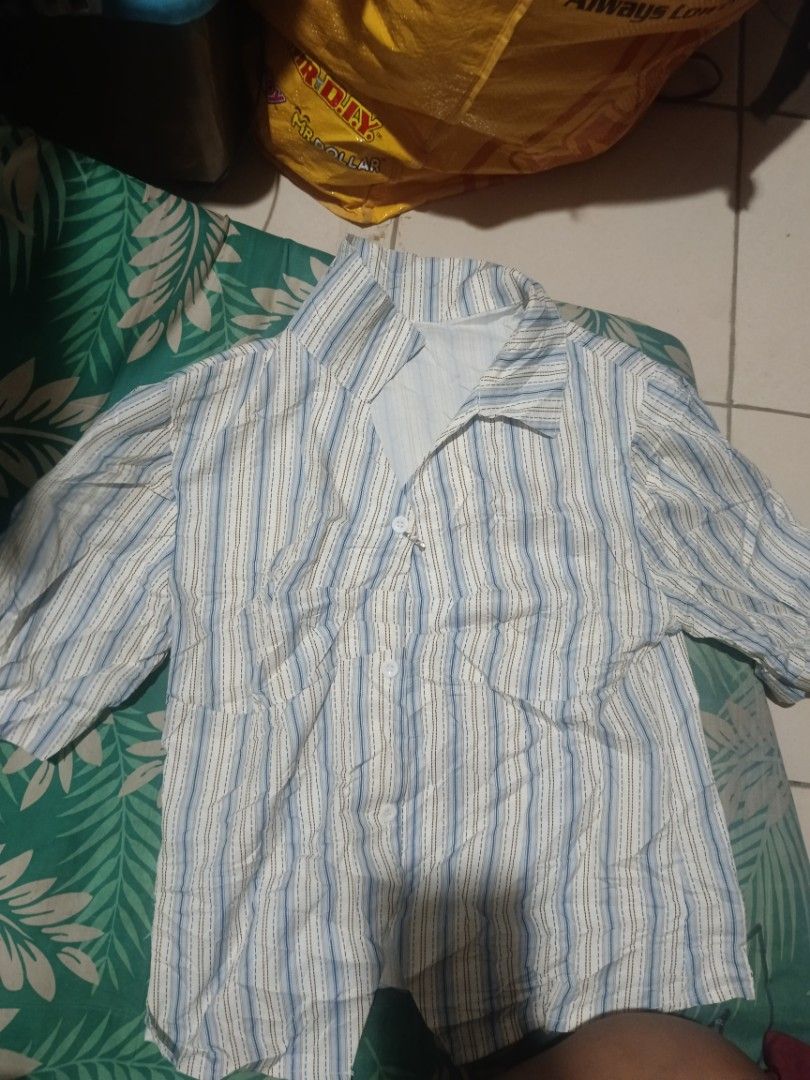 Striped Button-Up Shirt (Category: Blouses) located in Kapatagan. Submitted by corsethrift (Listing ID 1460952918, Image 1). Description: - Casual short-sleeve button-up shirt - Features stylish blue and brown stripes - Convenient chest pocket - Ideal for everyday wear.