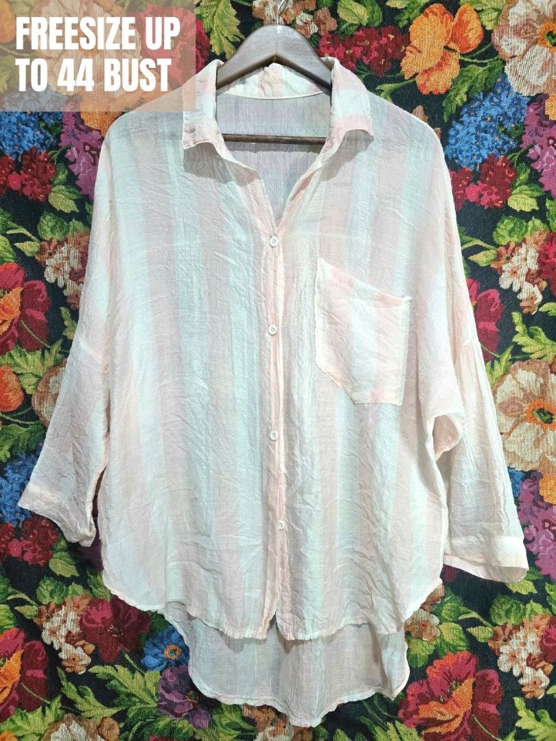 Striped Oversized Shirt (Category: Shirts) located in Paranaque City. Submitted by titaartestudio (Listing ID 1461098911, Image 1). Description: - Lightweight fabric - Pink and white vertical stripes - Single chest pocket - Button-up front - Relaxed, oversized fit - Crinkled texture - Ideal for casual wear or layering.